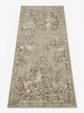 Machine washable botanical area rug in warm natural tones