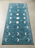 Celestial Moon Phases Washable Area Rug with teal cosmic design