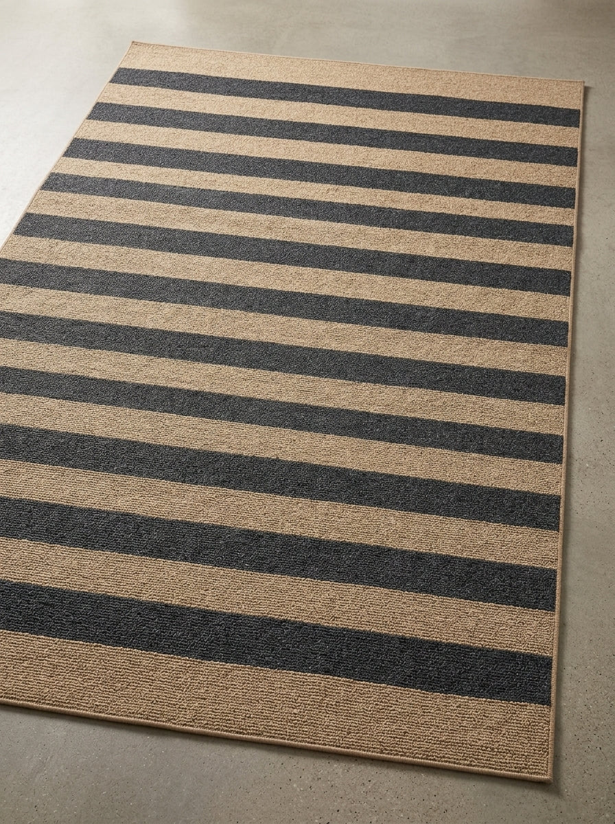 Coastal Harbor Stripe Performance Rug with bold black and natural stripes