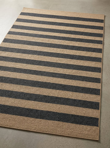 Coastal Harbor Stripe Performance Rug with bold black and natural stripes