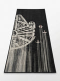 Washable tufted rug featuring futuristic space artwork