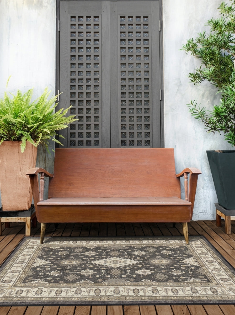 Weather-resistant patio rug in warm brown and gold tones