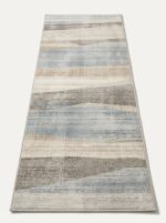 Soft tufted polyester area rug with waterproof barrier